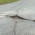 Pothole at 6–98 Peach Ave